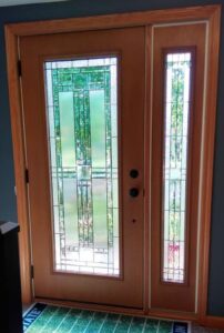 Picture of the interior of a recently installed front door with decorative glass.
