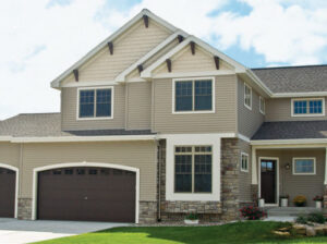 Picture of the front of a house with new vinyl siding.