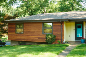Picture of a house with recently installed wood siding.