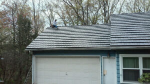 Picture of aluminum shake roofing on a house.
